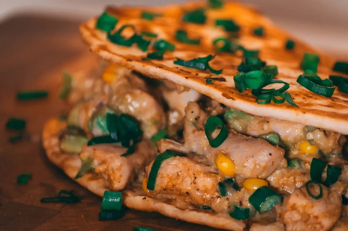 wrapped enchiladas on wooden surface